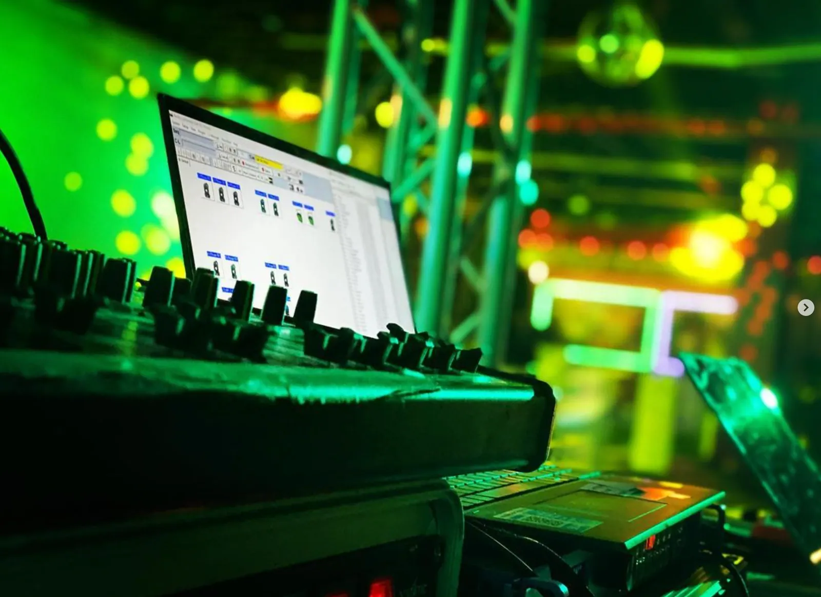 DJ controller under green stage light