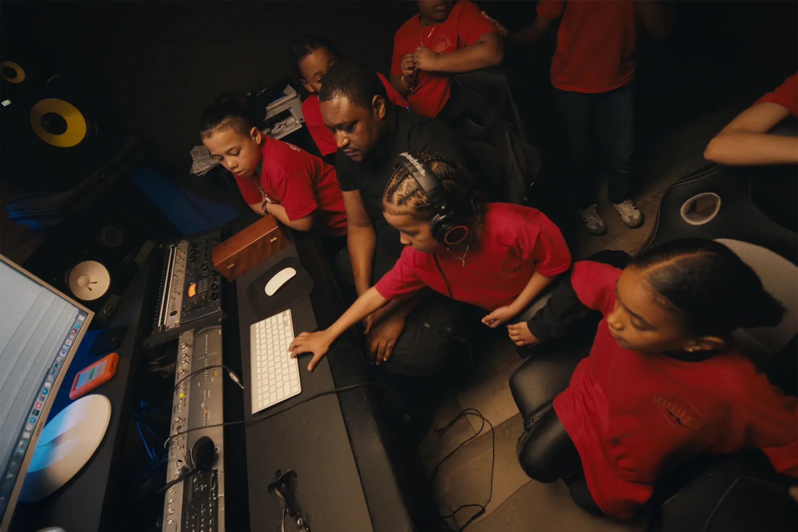 Overhead view of students around the mixing console