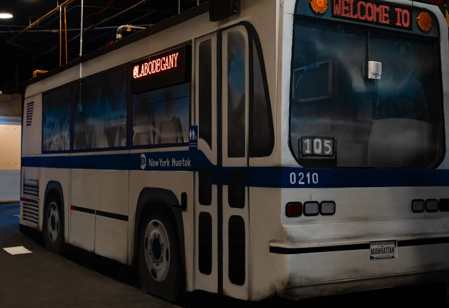 Full-size city bus parked inside the studio
