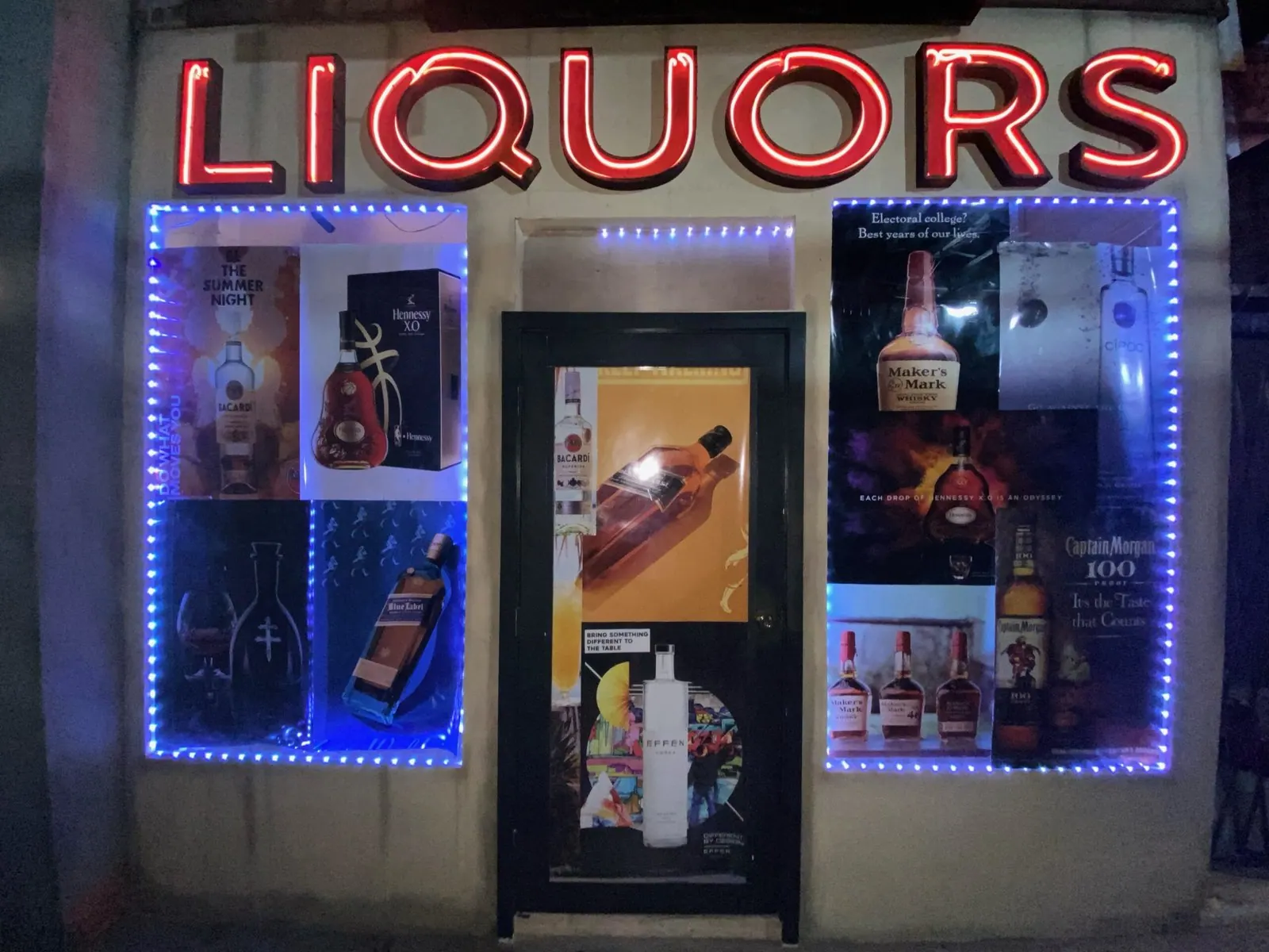 The neon Liquors sign glowing on the set