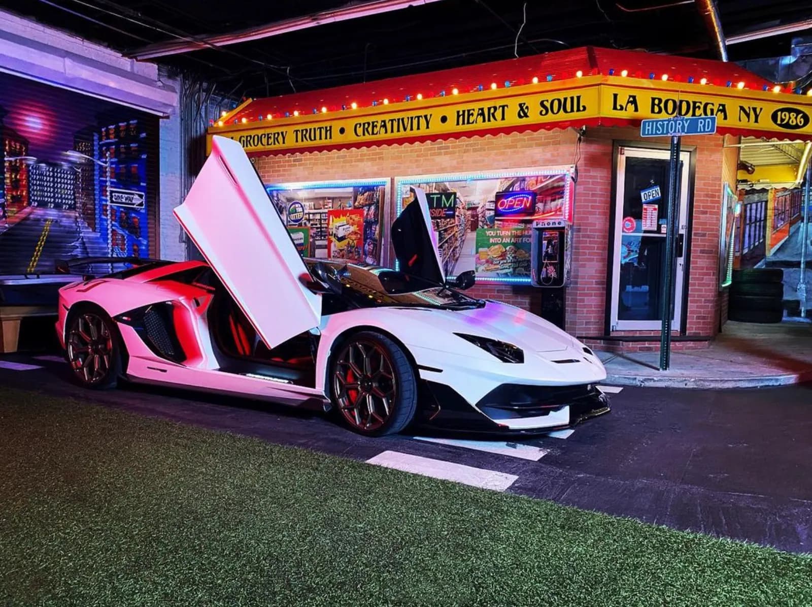 White Lamborghini with its doors up on the street set